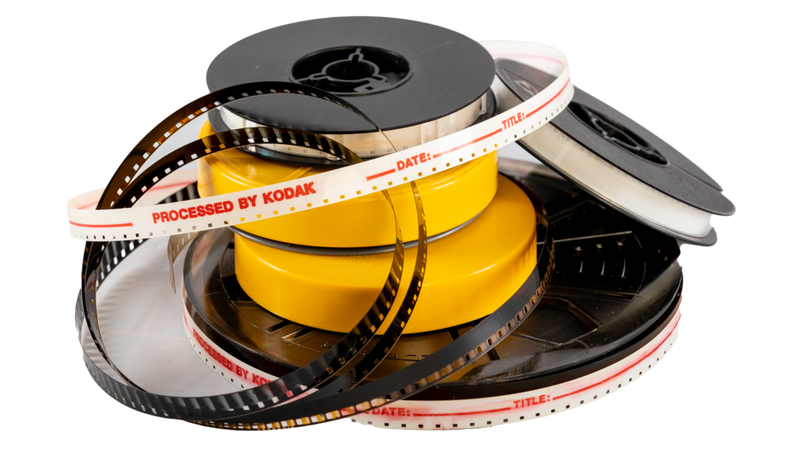 Pile of 8mm vs Super 8 film reels for digital conversion
