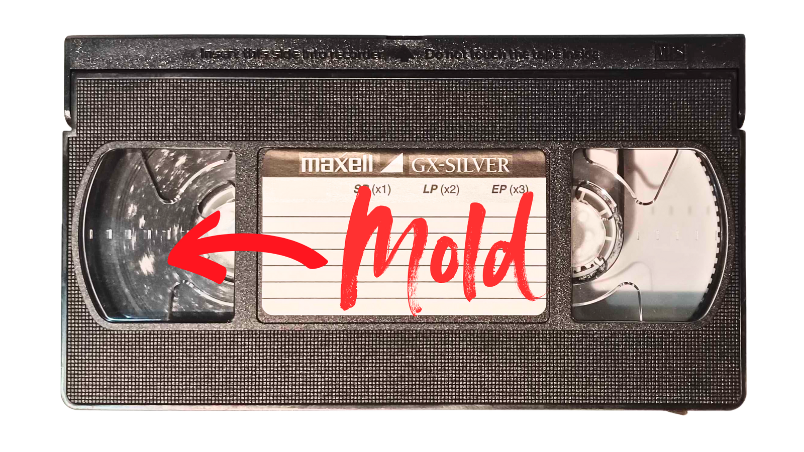Moldy VHS tape with visible white powdery damage