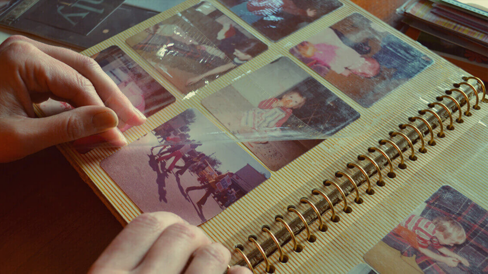 Sticky sheet photo albums with aging adhesive and stuck photos