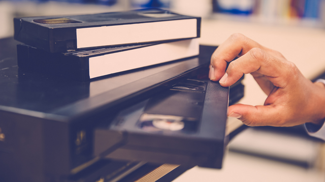 Stuck VHS tape in a video cassette recorder player needing rescue