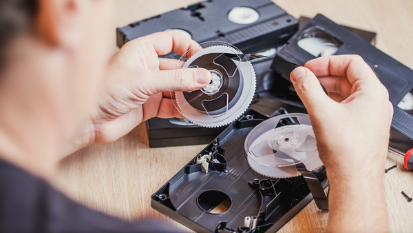 Moldy video tape being repaired after cleaning