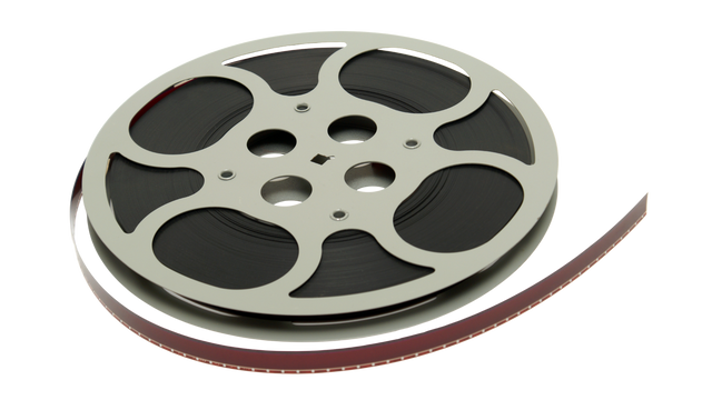 Close-up of 16mm movie film reel and deteriorating acetate strip