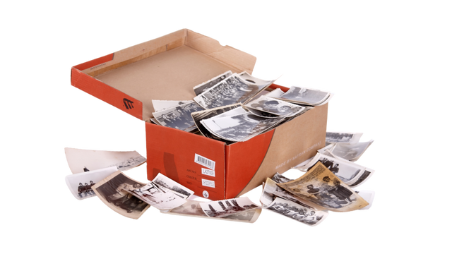 Box of photos being sorted for digital organization