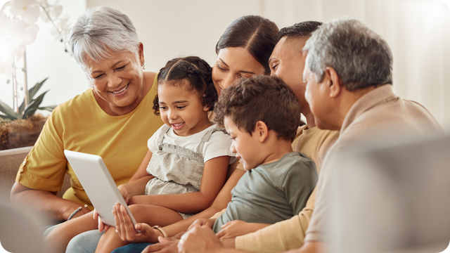 family viewing digitized photos together on tablet