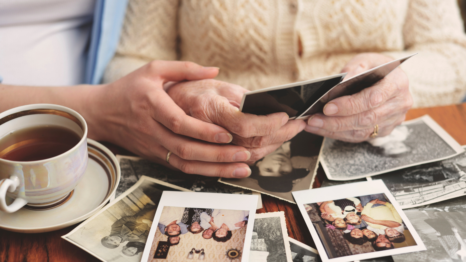 Family learning how to digitize photos using a professional photo scanning service