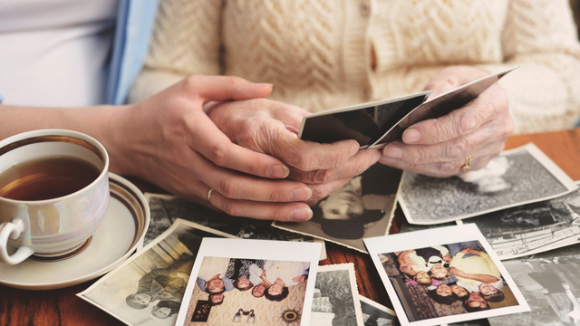 Family learning how to digitize photos using a professional photo scanning service