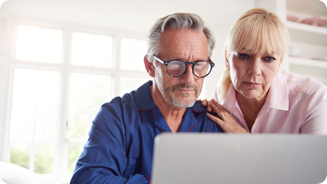 Stressed couple learning the true Legacy Box cost after sendning in their old media