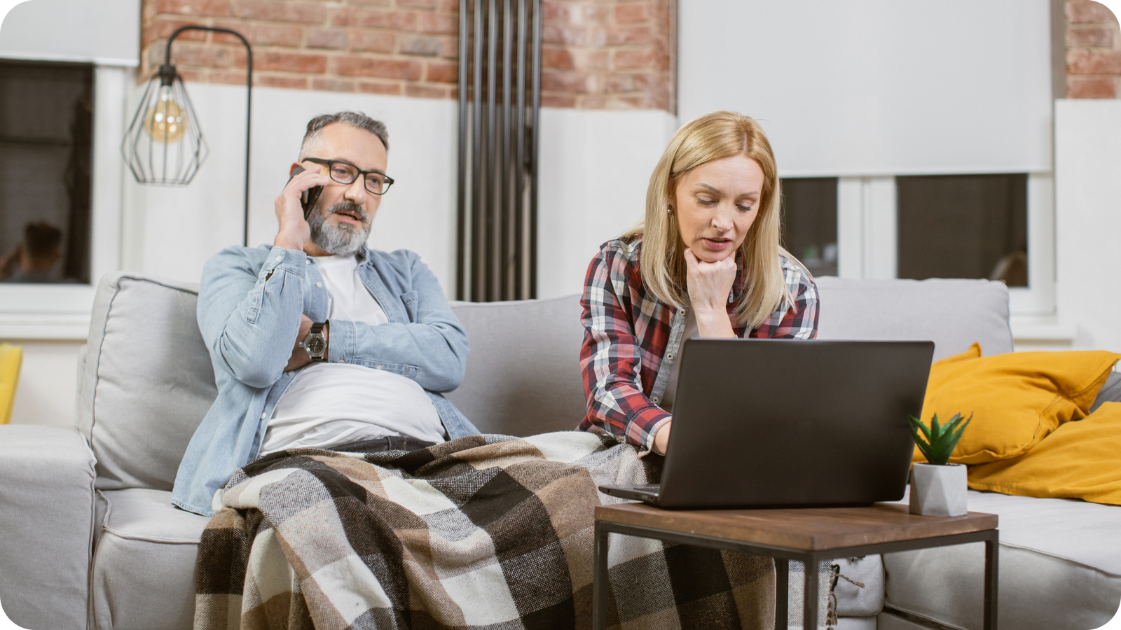 Frustrated married couple on hold with Legacybox while writing a negative Google review