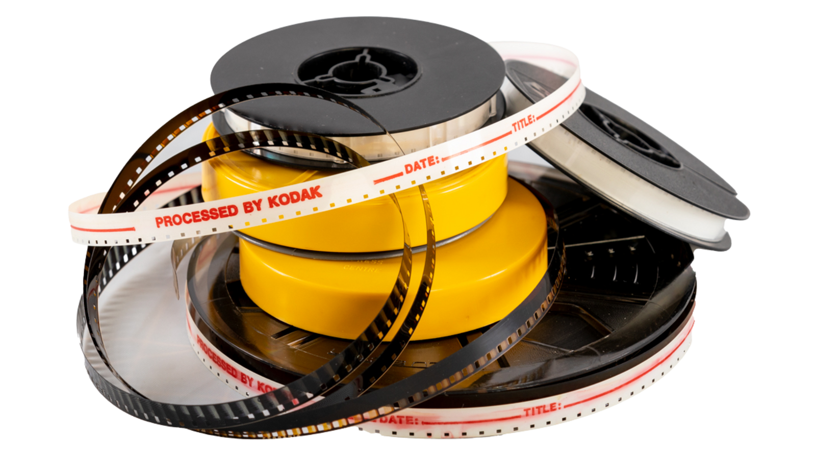 Pile of 8mm vs Super 8 film reels for digital conversion