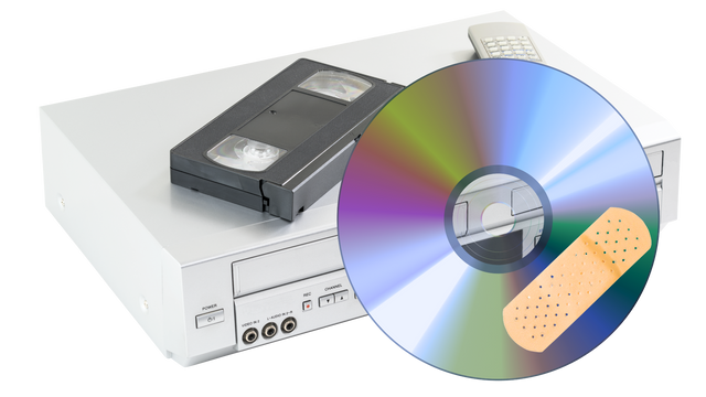 Old VCR with VHS Tape and Scratched DVD Showing Need for Digital Conversion