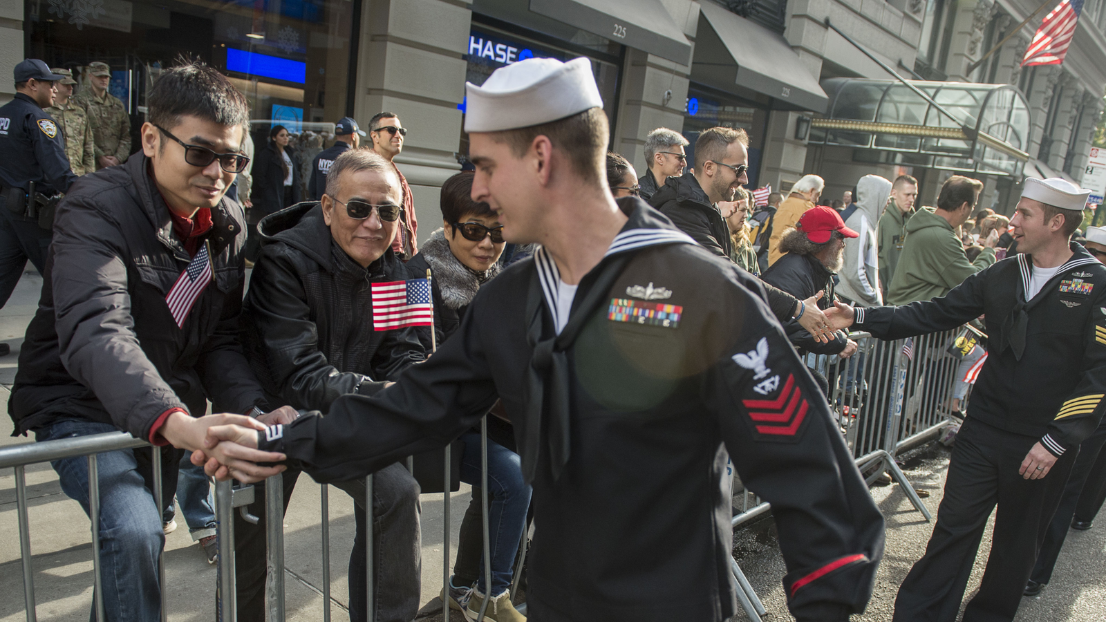 US Navy servicemember being thanked for their service during a community event