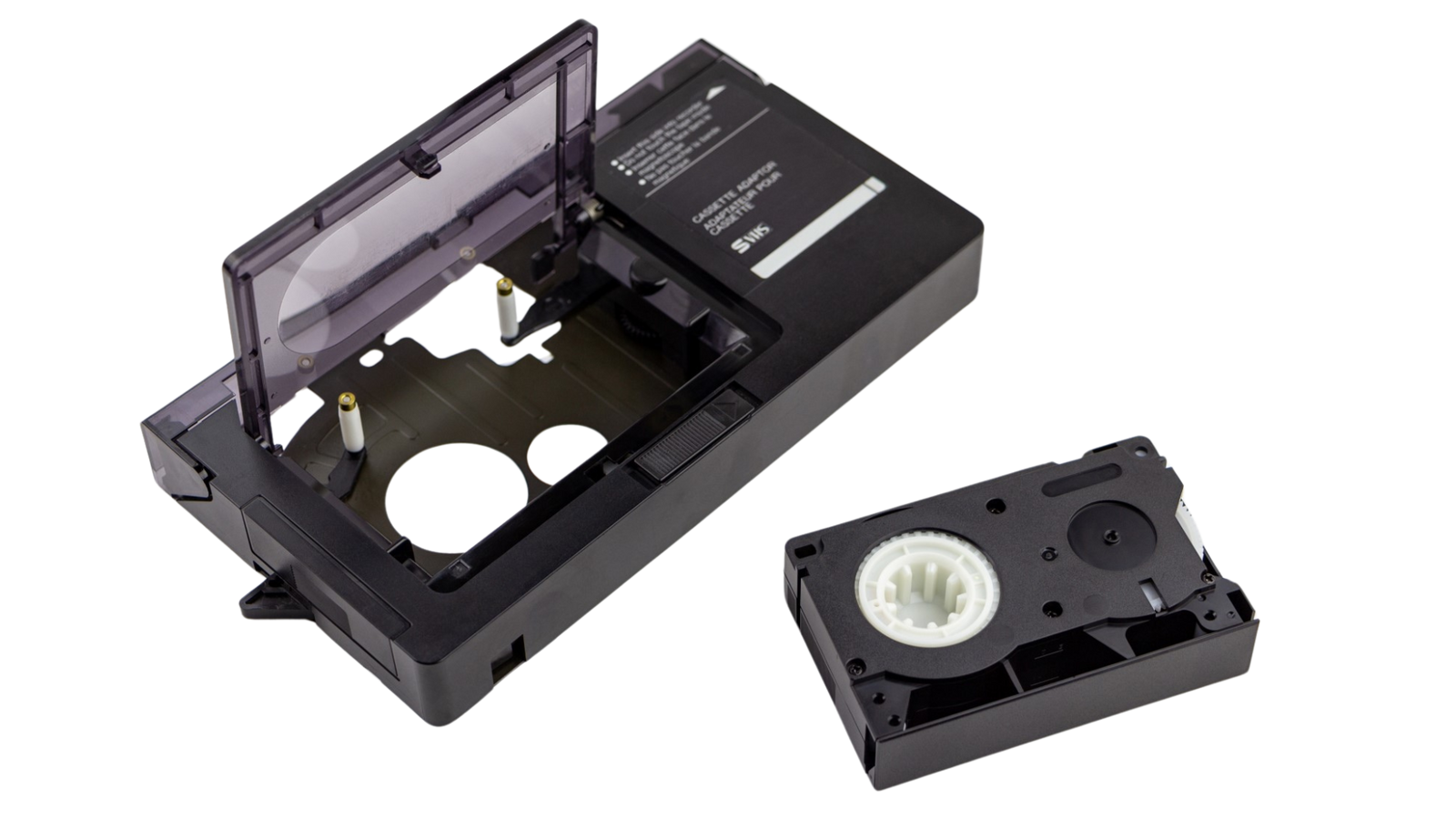 A side-by-side of a compact VHS-C cassette and its adapter