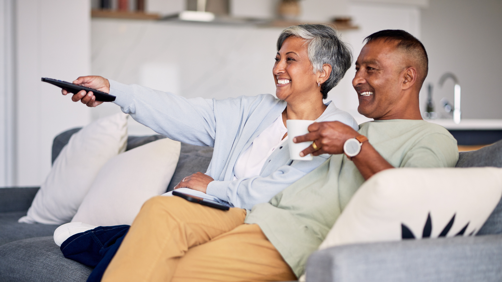 Couple rediscovering family memories together, representing a meaningful Valentine’s Day gift from Heirloom