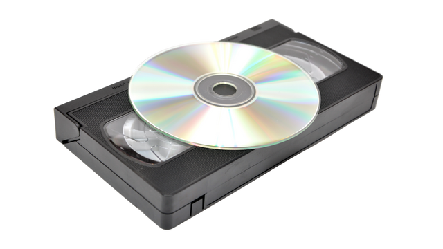 DVD on top of a VHS tape showing format transition