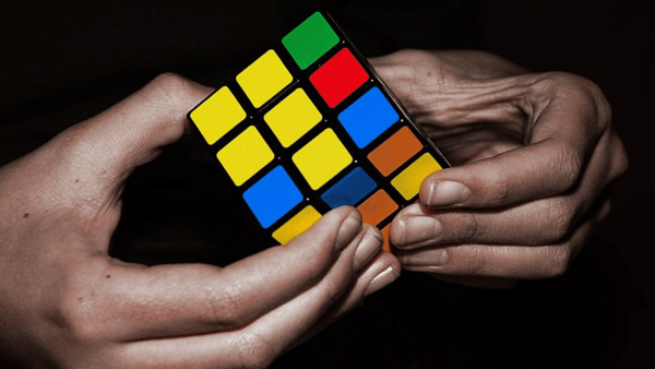 Autistic worker solving a Rubiks Cube